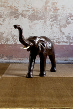 Load image into Gallery viewer, Vintage leather striding elephant sculpture
