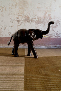 Vintage leather striding elephant sculpture
