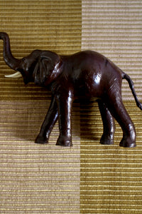Vintage leather striding elephant sculpture